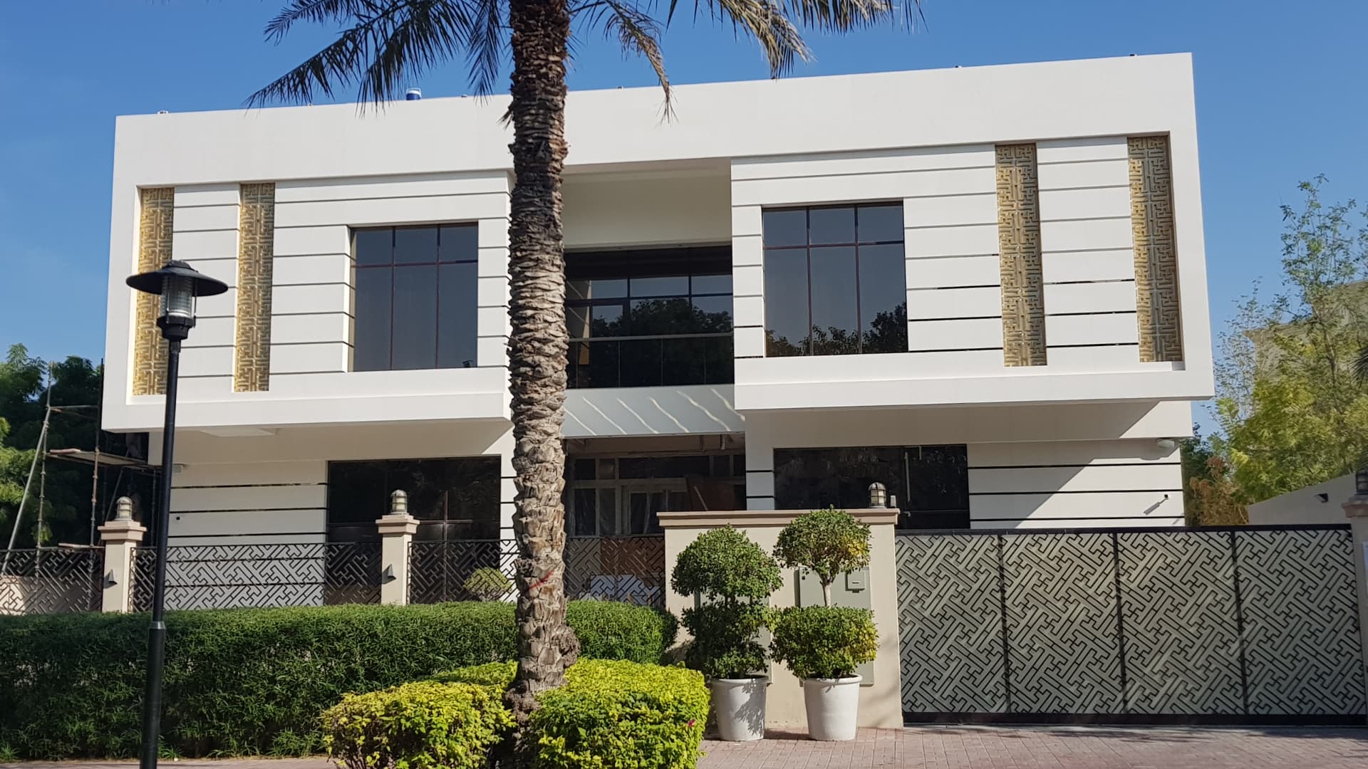 Contemporary white villa with feature screens