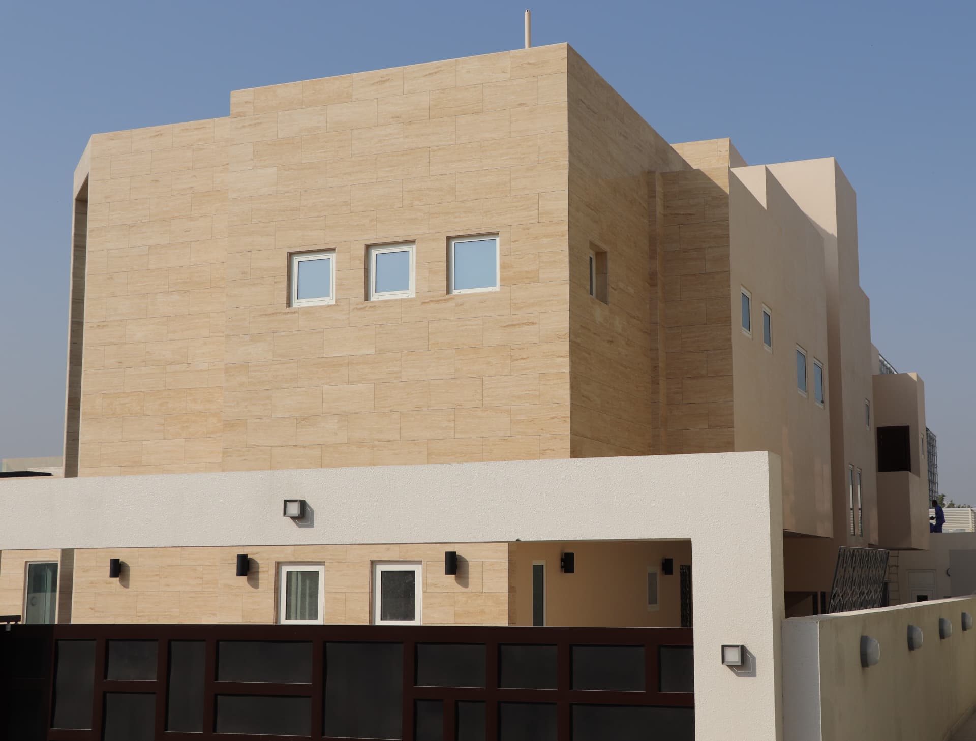 Travertine-clad villa facade